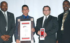 From left: minister of Trade and Industry, Mandisi Mpahlwa, Danie Gouws, Herman Theron, and chairman of the SABS Council, Prof Sibusiso Vil-Nkomo, at the awards ceremony